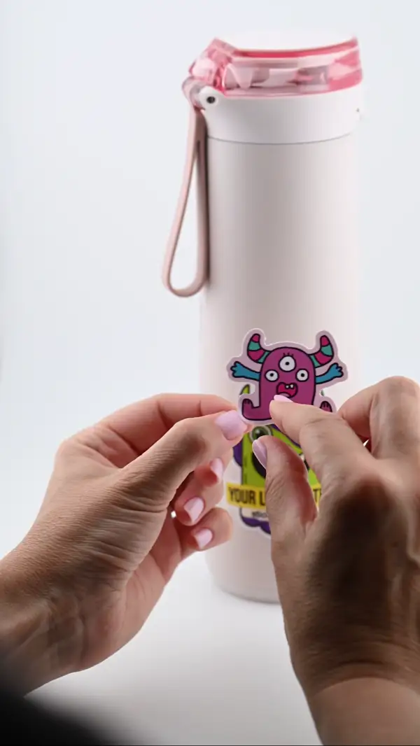 Applying a custom sticker to a water bottle