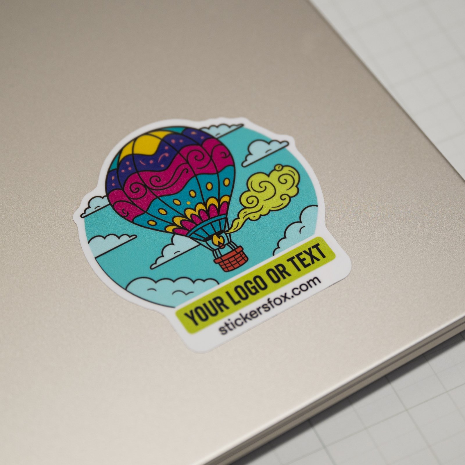 Custom die-cut sticker on a laptop lid
